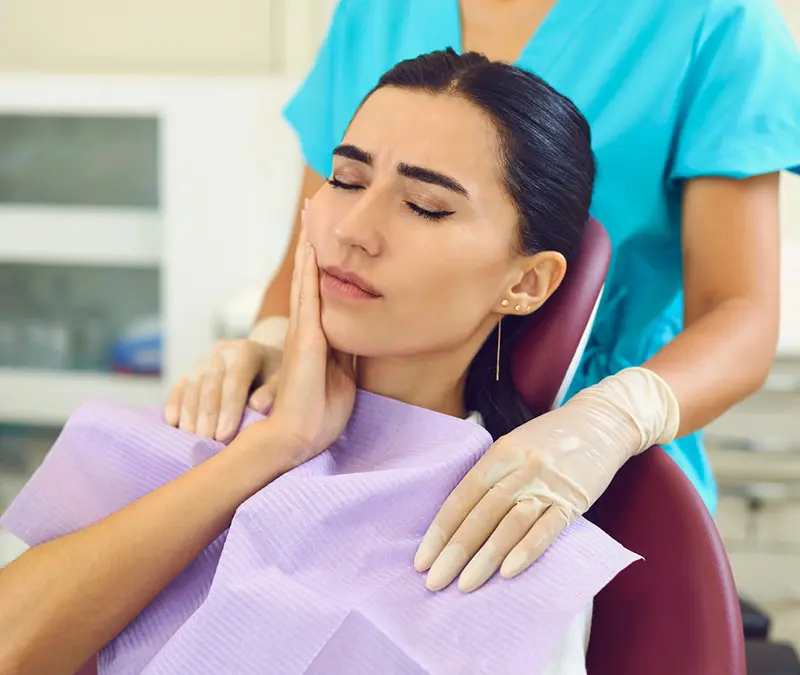Emergency dentist at Conklin Family Dental treating a patient with urgent dental needs
